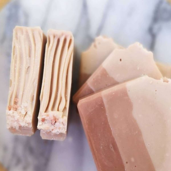 Pink layered soaps on a marbled slab