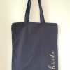 Navy blue tote bag with the word brid in gold vinyl lettering