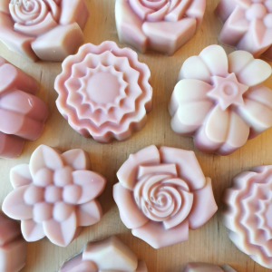 Handmade pink soaps in the shape of flowers